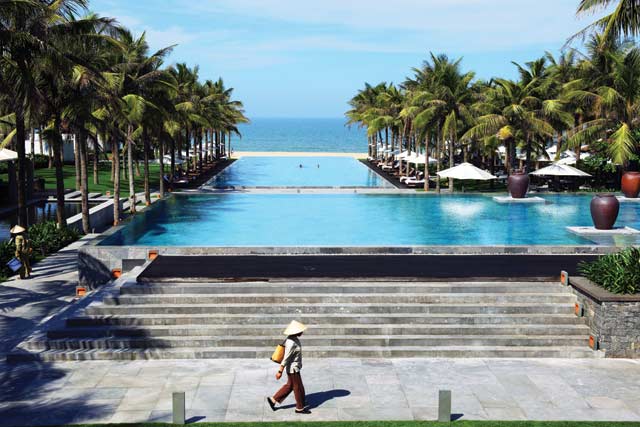 Blue heaven: the Nam Hai’s infinity pool is a highlight, made up of three pools, each sloping down into the next