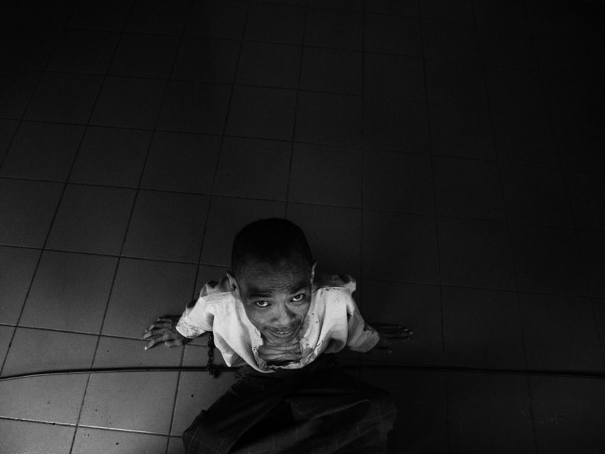 Photo by Dimitri Pilalis. An inmate 'rests' at Yayasan Gunung Putri hospital in Indonesia. With just 51 mental hospitals in the country, unprepared community health centres are often on the front line when treating the mentally unwell.