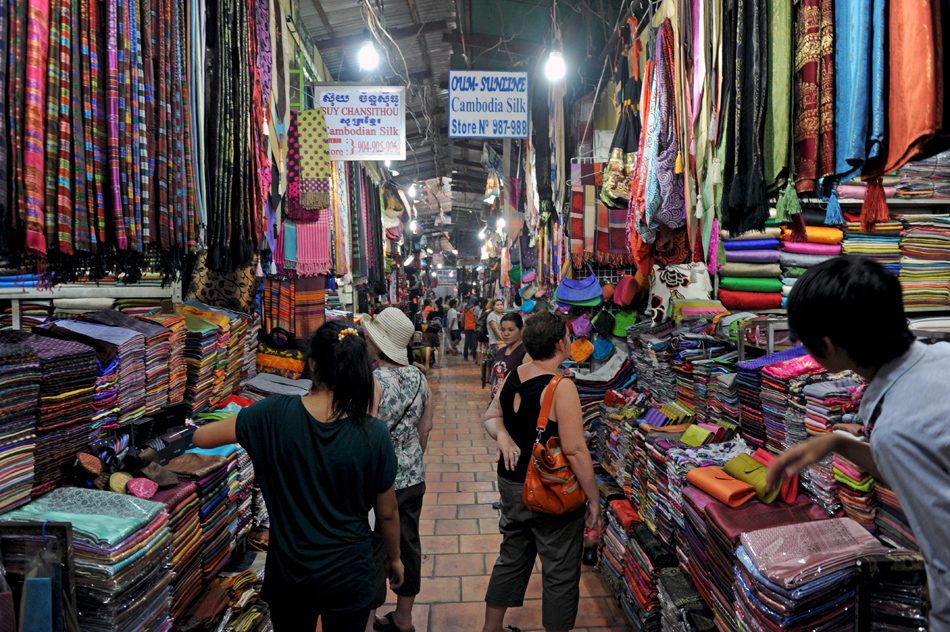 Photo by Philip Heijmans for SEA Globe. Short supply: silk sellers in Phnom Penh’s famous Russian Market resort to selling knock-offs.