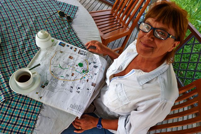 Patrizia Zolese enjoys a coffee while explaining her work. The Italian spends much of her time in Laos, Vietnam and Myanmar, developing conservation themes and digging methods