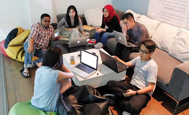 Money maker: a group of social media strategists chat at an advertising agency in Jakarta. The Indonesian capital is the world’s biggest Twitter community, and advertisers eager to reach the under-30 crowd are paying popular Twitter users to spread their word through social media, with payments starting at about $21 per tweet. Reuters