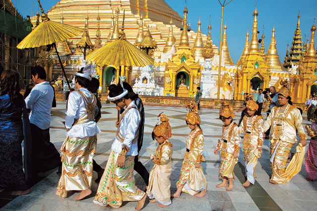 Taking shelter:  a shinpyu Buddhist  novitiation ceremony is held at Shwedagon Pagoda.  Bruno Barbey (France)