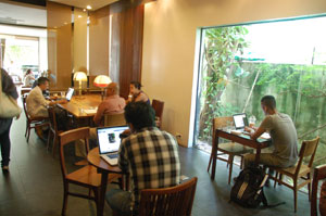 Dime a dozen: independent workers take up every tale at a Phnom Penh coffee shop