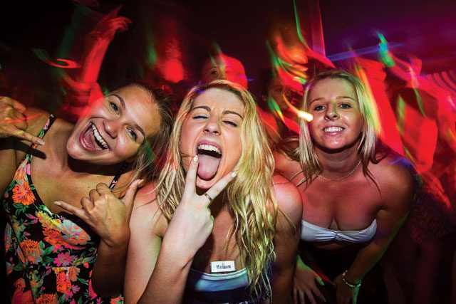 Stay classy: a group of girls pose at a nightclub in Kuta, Bali. Indonesia remains popular among young travellers due to the availability of cheap alcohol. Getty Images