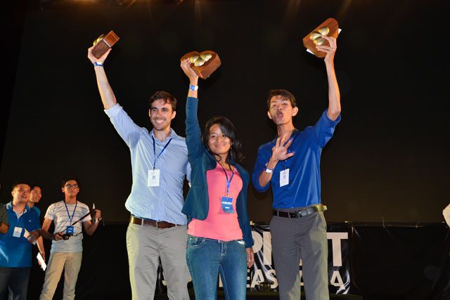 Sothea Ines holds her winner's trophy aloft. Photo: Michael Chuan