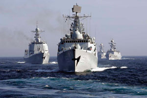 Victims of war: Chinese missile destroyer, the Wuhan (front) during an excercise at sea. Photo: AP Photo 