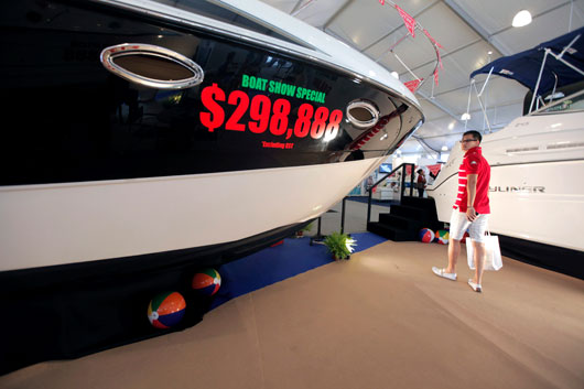 Full-figured: a prospective buyer eyes a yacht for sale in Singapore. Wealth inequality could spell trouble in Asean countries if it is not addressed soon. Photo: AP/Sam Kang Li