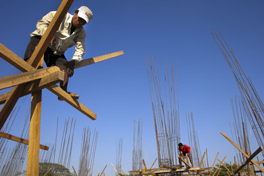 Big boom: Burmese workers on a construction site in Yangon, Myanmar. Photo: Getty Images/Paula Bronstein