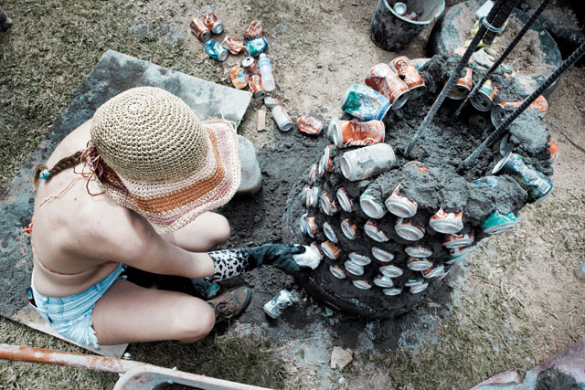 A support column containing recycled cans is built at the Philippines' 'Windship', a project similiar to the one being built in Indonesia