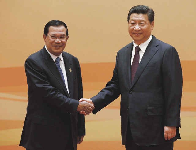 Making connections: Hun Sen shakes hands with China’s President Xi Jinping during last month’s Dialogue on Strengthening Connectivity Partnership in Beijing. Photo: Kim Kyung-Hoon/Reuters