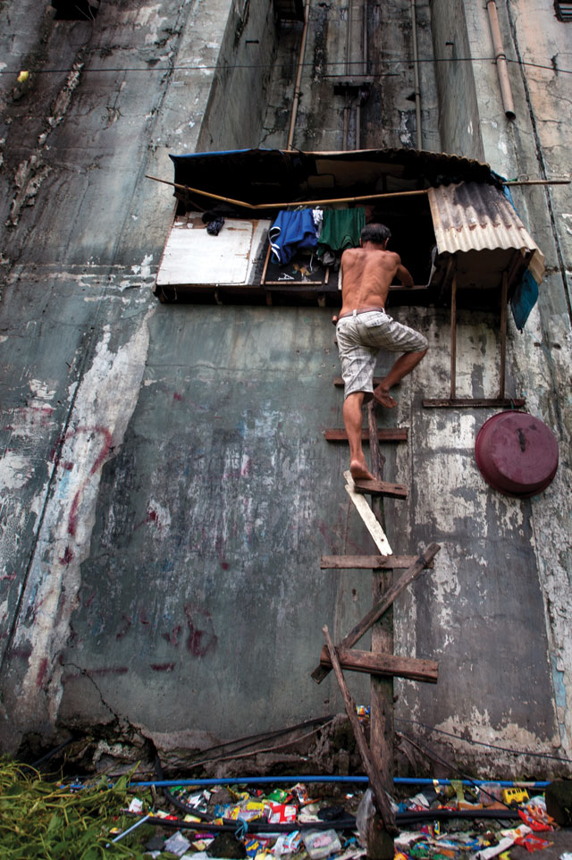 Shocking conditions: Leo’s home is directly underneath a power station for the building. When it rains, Leo and his children cannot touch the walls of their house or they receive a strong electric shock. Photo: Luc Forsyth