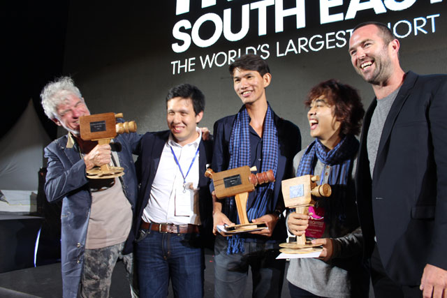 Panel judge and renowned cinematographer Christopher Doyle (left) jokes onstage with Tropfest SEA 2015 winners Jake Soriano (second left), Ly Polen (centre) and Somchanrith Chap (second right), alongside fellow judge and Australian actor Sullivan Stapleton on Sunday night in Penang. Photo: Katy Lo Wing