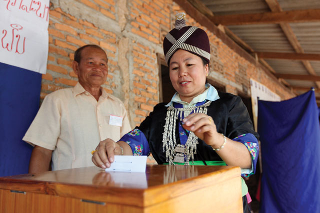 Choices, choices: a Hmong woman casts her ballot during the 2006 National Assembly election. A one-party state, elections are held every five years for the country’s legislature