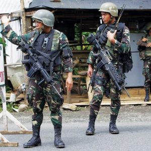 En garde: soldiers man a military checkpoint during preparations for the Kadayawan festival in Davao City in 2011 