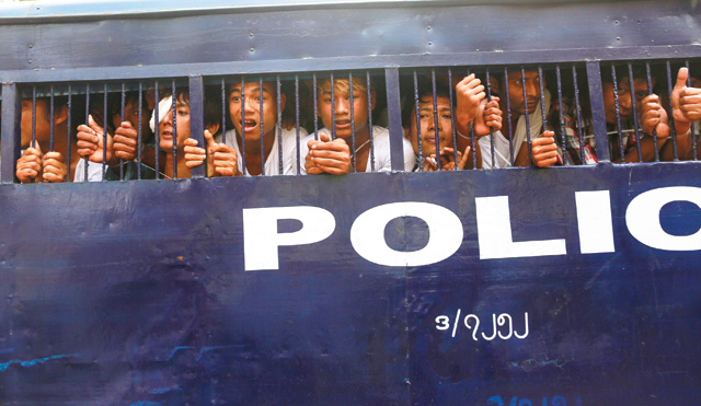 Barred: Myanmar student protesters are transported to a court in Letpadan after clashes with police in March. Photo: Reuters 