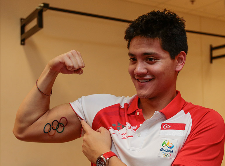 Olympic gold medalist Joseph Schooling of Singapore shows off an Olympic tattoo