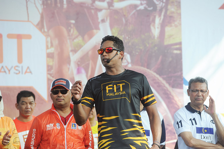 Khairy Jamaluddin takes to the stage to lead a ‘Fit Malaysia’ event last year