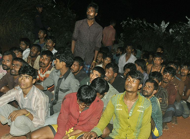 Ethnic Rohingya refugees after being arrested by Thai police