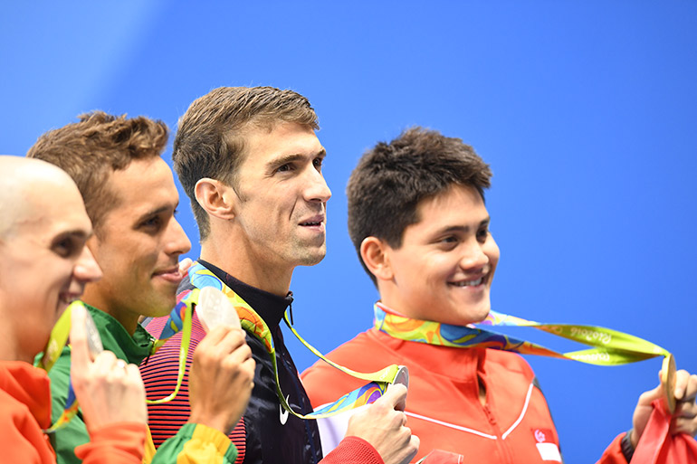 Joint silver medalists Laszlo Cseh of Hungary (L-R), Chad Guy Bertrand Le Clos of South Africa, Michael Phelps of USA, and Gold medalist Joseph Schooling of Singapore pose during the round of honour