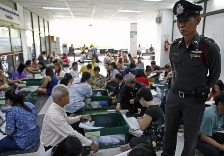 Police stands guard at voting for Thai constitution