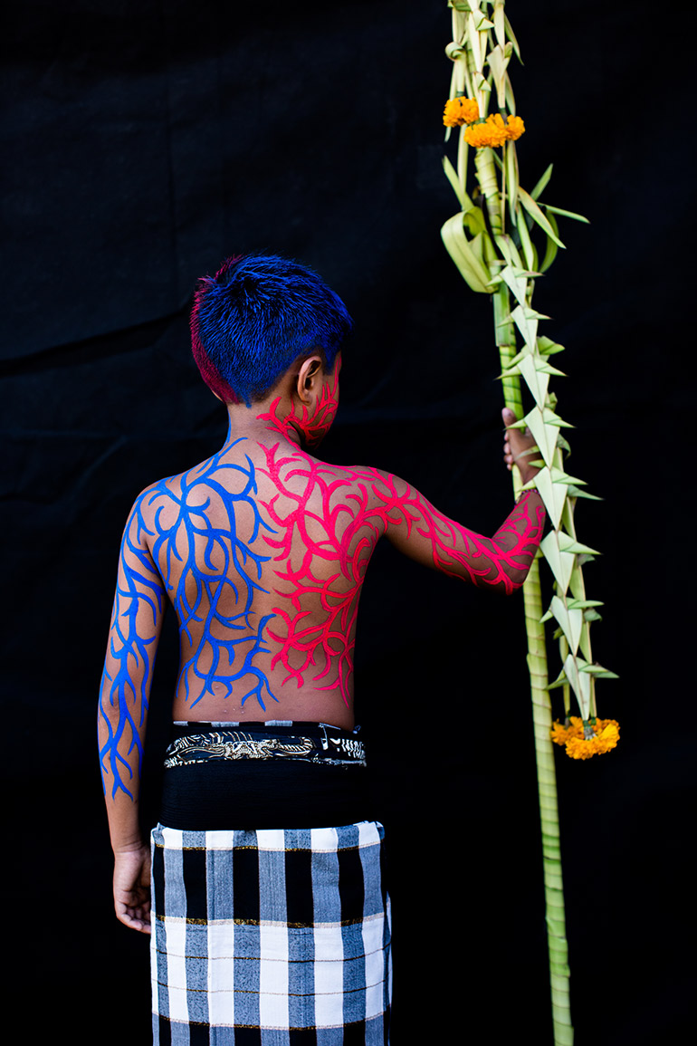 Colour detail: nine-year-old Putu Gde Dipta Adi Arnawa shows off the intricate body paint on his back