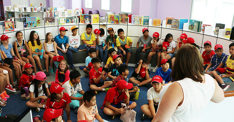 The International School of Phnom Penh students enjoy a lesson in the school’s impressive elementary library