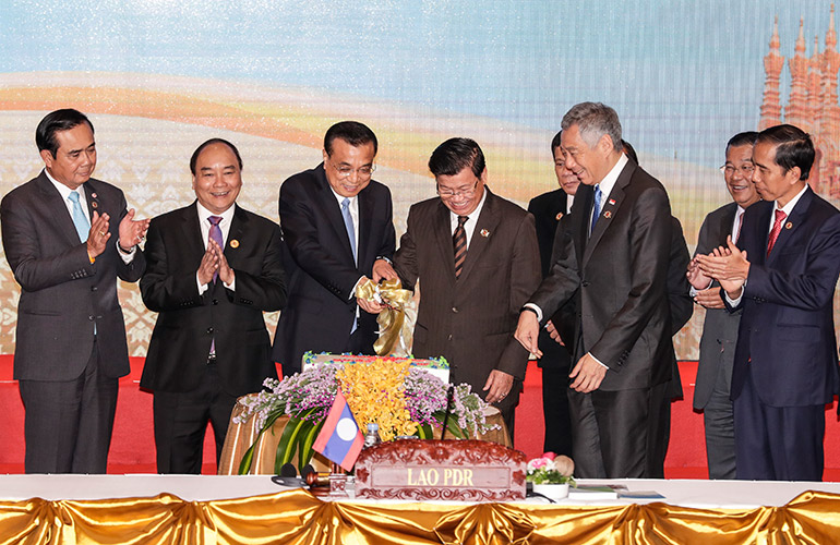 China's Premier Li Keqiang, and Asean heads of state participate in the cake cutting ceremony commemorating 25 years of the Asean-China cooperations on the Asean - China Summits at the National Convention Center in Vientiane, Laos