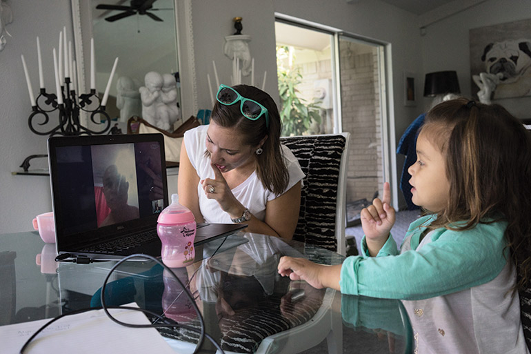 From Dallas, Texas, Beach and Kathleen sing a song on Skype to Ly Hov in Phnom Penh. Being apart for half a year, the family talk on Skype almost every day