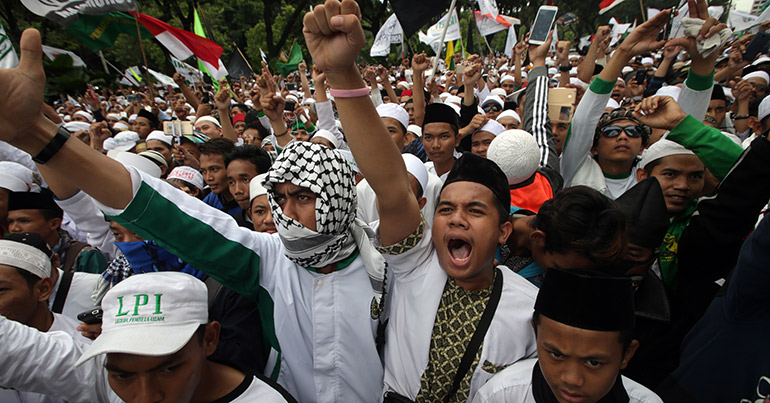 Protests gesture during a demonstration against Jakarta governor Basuki Tjahaja Purnama in Jakarta, Indonesia, 14 October 2016.