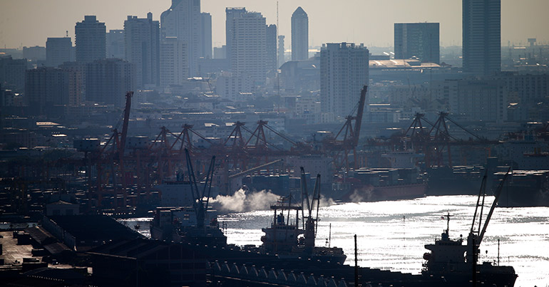 A picture made available 02 December shows cargo ships in the Chao Phraya River in Bangkok, Thailand