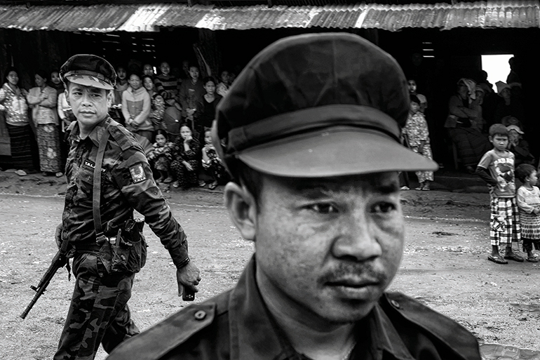 Ta’ang National Liberation Army soldiers explain to Ta’ang villagers why they are fighting with the Shan State Army, another ethnic armed group