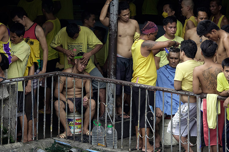 Inmates receive haircuts at Quezon City Jail, one of the country's most congested jails, Quezon City, Philippines