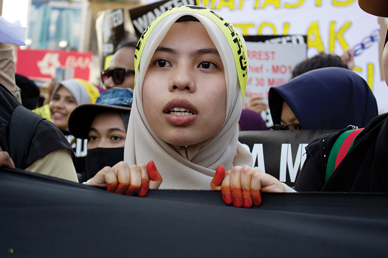 a female student leads a protest at Bersih 5 in Kuala Lumpur