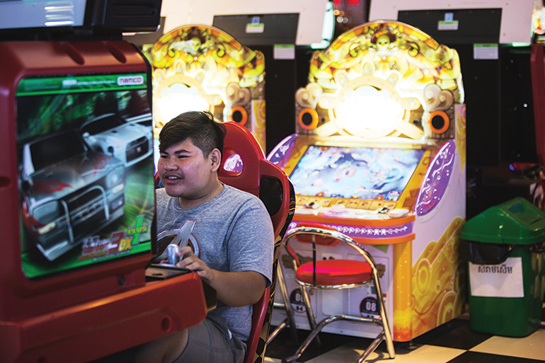 A young man plays a video game at Phnom Penh’s Aeon Mall