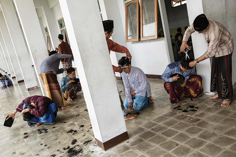 students gather to socialise outside their shared living quarters