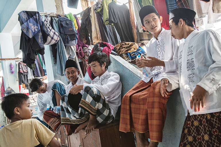 caretakers cut the hair of students, who are forbidden from having long hair at the school