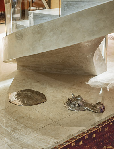 Heinecke's penthouse includes such wonders as an abstract silver hippopotamus