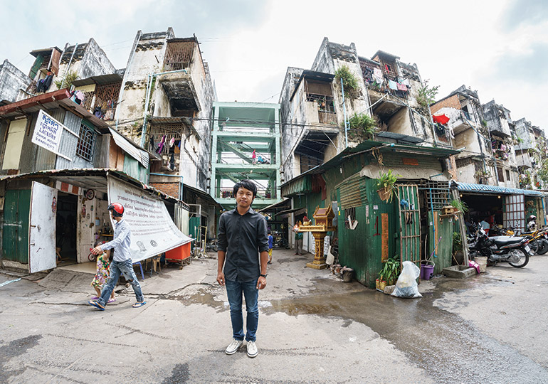 Architects Pen Sereypagna (above) and Virak Roeun (below) believe Phnom Penh's iconic White Building (pictured in its current state above)could be restored into government-funded social housing