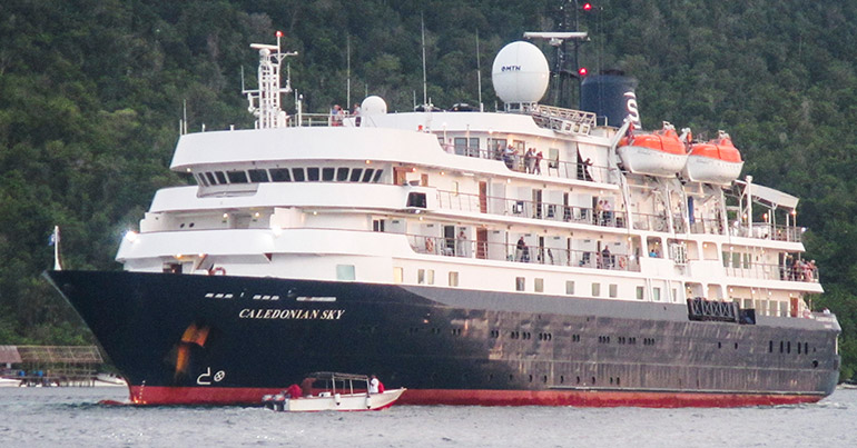 A handout photo made available by the Indonesian Search and Rescue Sorong on 15 March 2017 shows a British-owned cruise ship 'The Caledonian Sky' which is trapped in shallow water in Raja Ampat, West Papua, Indonesia