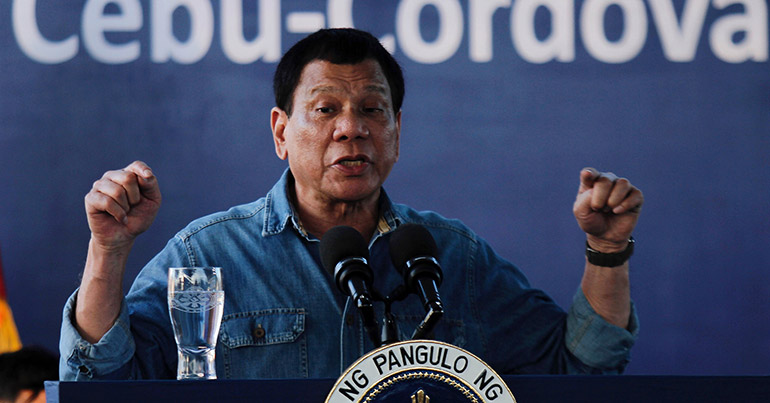 Philippine President Rodrigo Duterte gestures as he speaks during a ground breaking ceremony of the Cebu-Cordova Link Expressway in the town of Cordova, Cebu province, Philippines