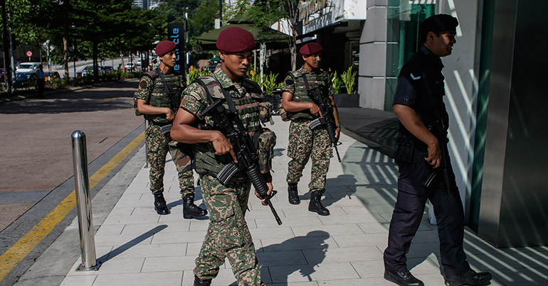 Malaysian Armed Forces with a Royal Malaysian Police patrol outside a shopping mall at Kuala Lumpur, Malaysia