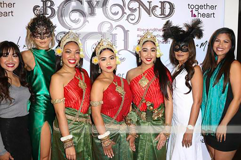 Together1heart president AnnaLynne McCord and vice-president Somaly Mam (in masks) attend the ‘Beyond the Veil’ masquerade ball to benefit their NGO in Los Angeles in December 2016. Photo: Associated Press