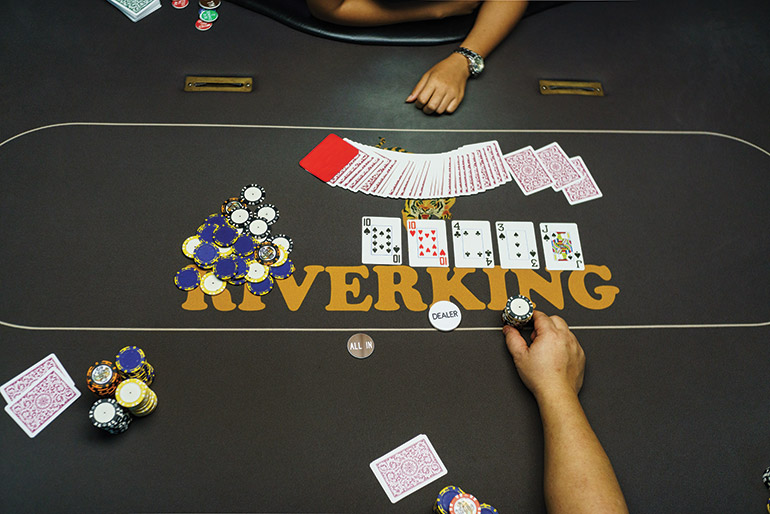 A player places a bet on a game at Phnom Penh’s Riverking poker room. Photo: Sam Jam