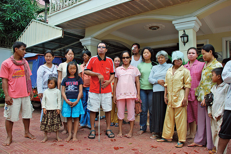 Acid attack survivors gather in front of the CASC centre in Phnom Penh in 2009. Photo: Sam Jam