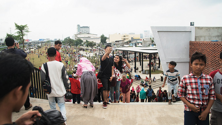 Teenagers take selfies in Jakarta's Kalijodo park. Photo: Arman Dzidzovic