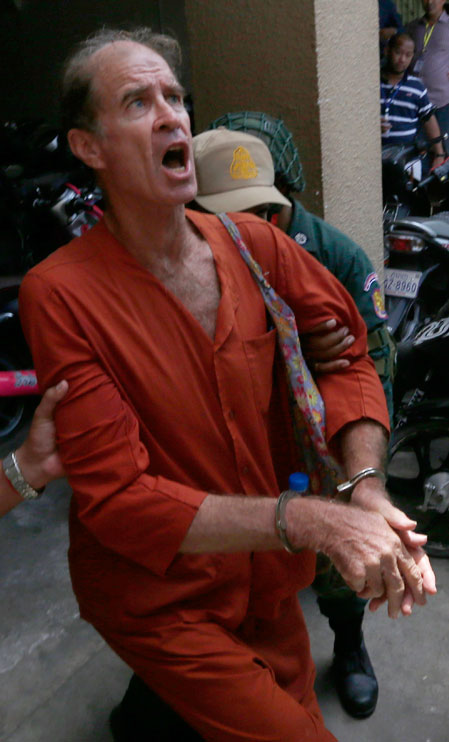 James Ricketson escorted by Cambodian police officers while leaving at the Phnom Penh Municipal Court in Phnom Penh, Cambodia, 15 June 2018. Southeast Asia Globe_EPA Images