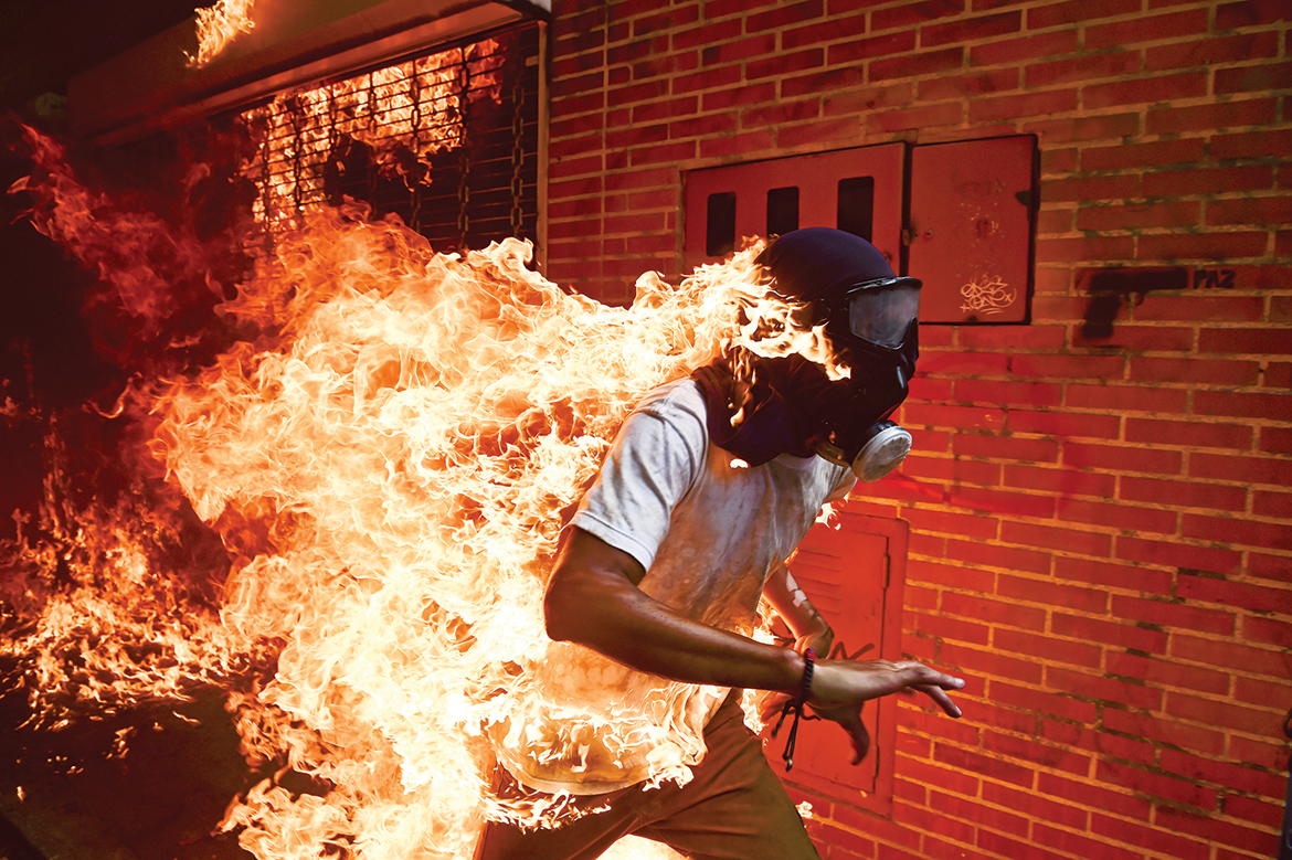 Ronaldo Schemidt_Crisis_Angkor Photo Festival_Cambodia_Venezuela_Nicolas Maduro_protester_fire_José Víctor Salazar Balza_2018 World Press Photo of the Year_Southeast Asia Globe 2018