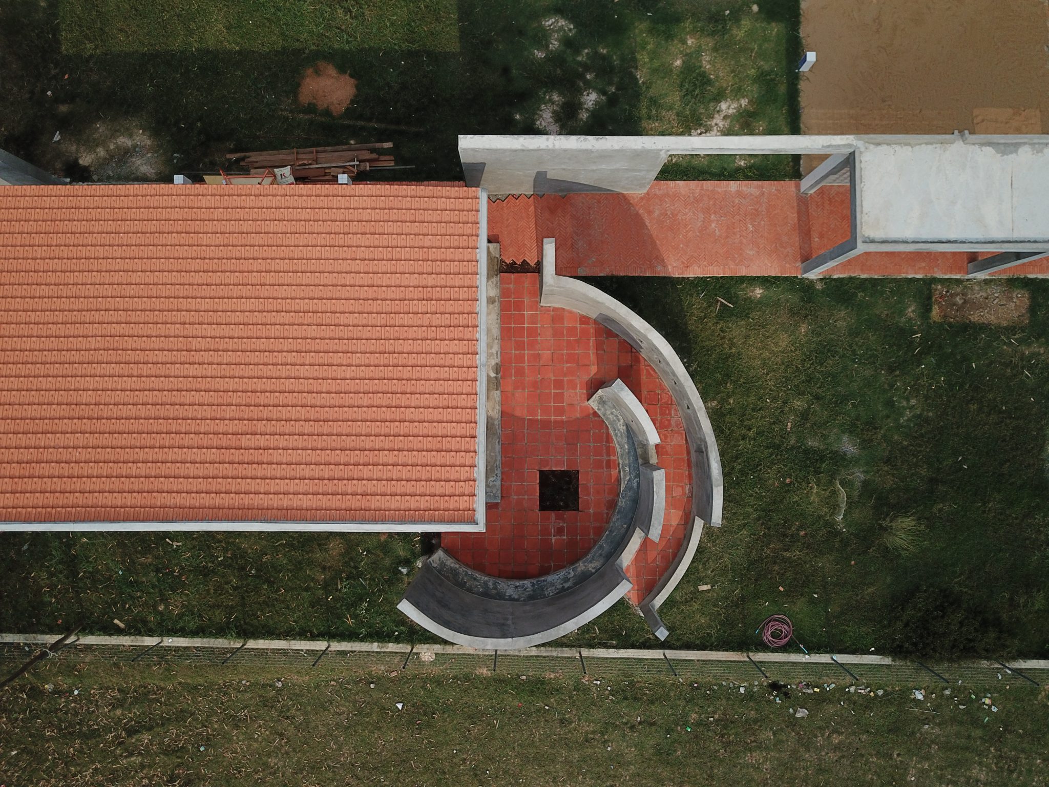 Thnout School is composed of different classrooms and functions of a school to be organised around a centripetal courtyard. By interrogating the typology of the monastic cloisters, Thnout School is an architectural experiment that redefines learning environments in a rural context