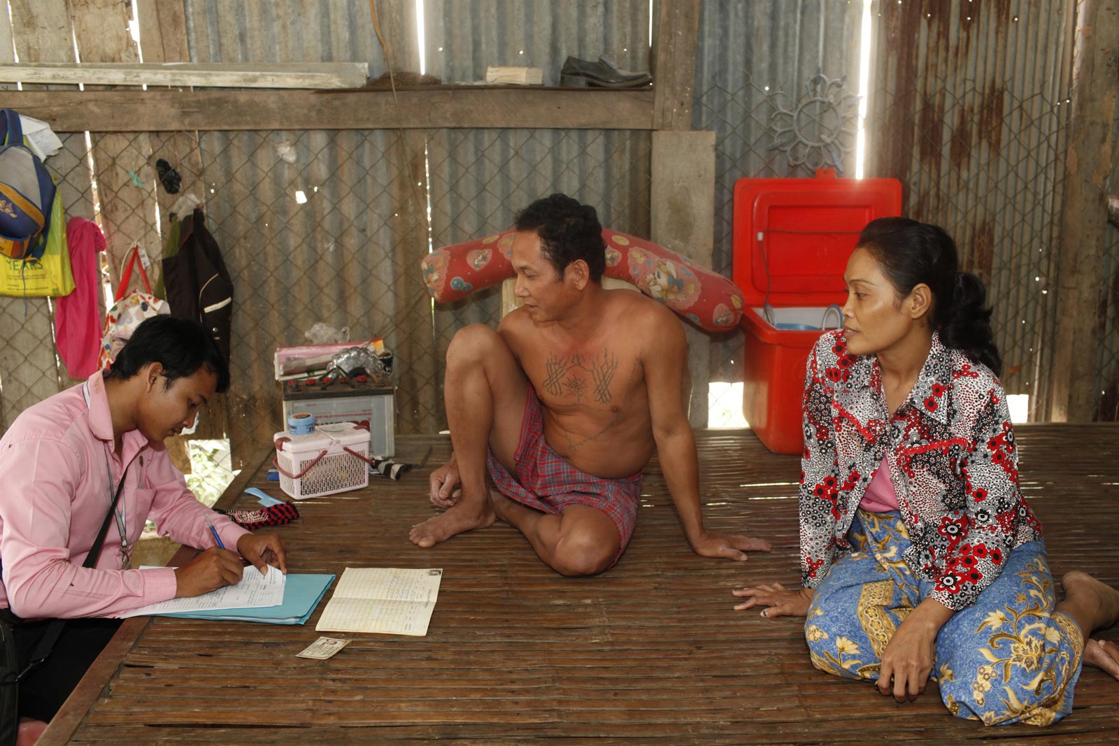 Chamroeun microfinance loan officer Chin Sokreth at a client's home in Cambodia