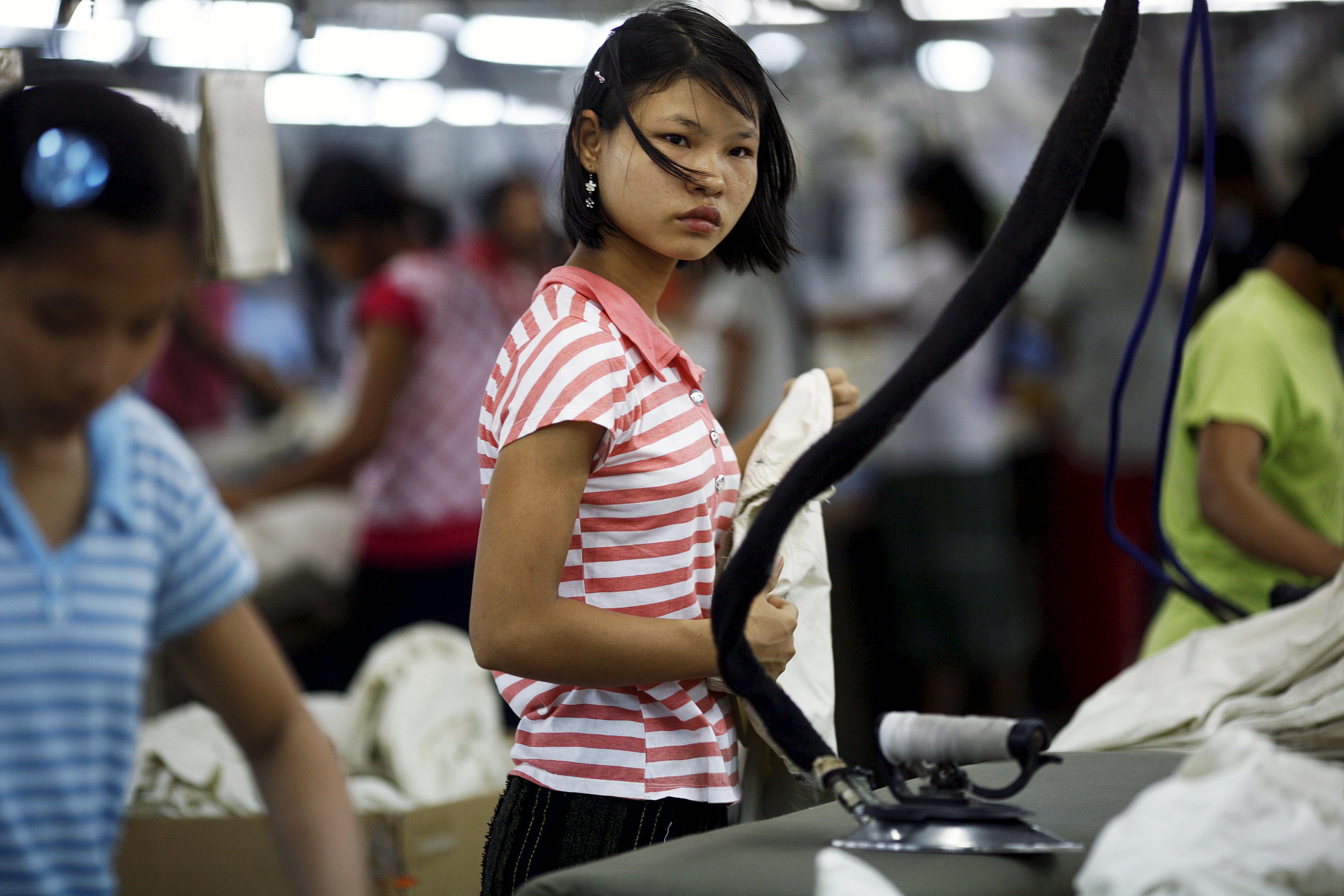 A worker looks on at a garment factory at Hlaing Tar Yar industry zone in Yangon. Photo: Soe Zeya Tun / Reuters